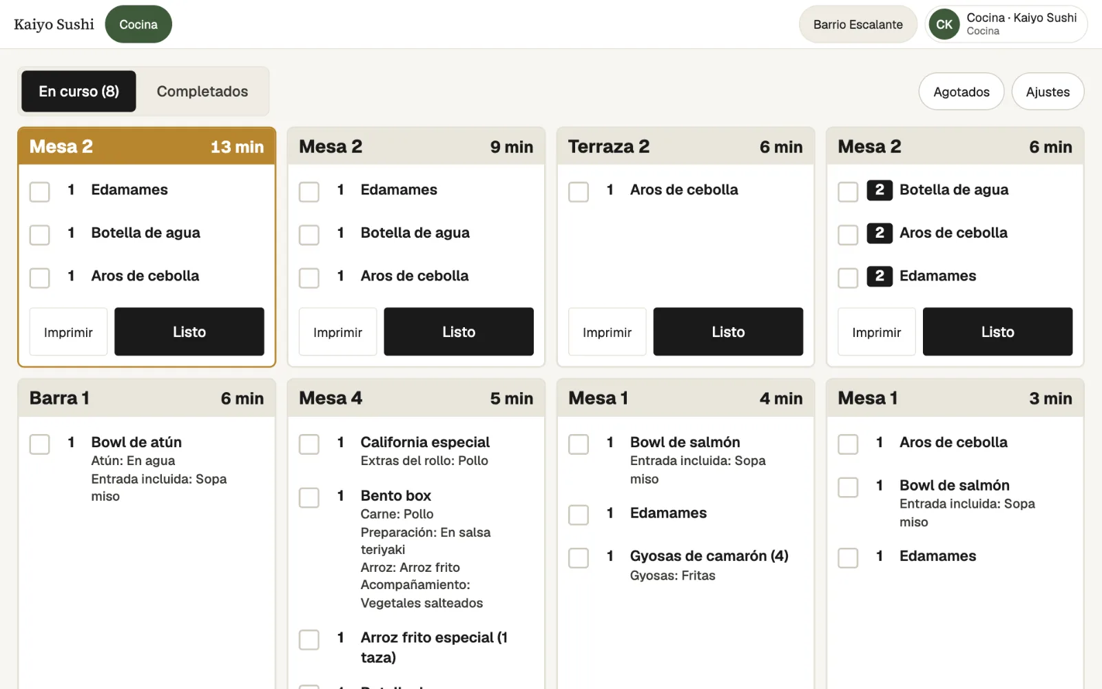 The kitchen display (in Spanish): open tickets per table with elapsed minutes, each dish with its options, and Print and Ready buttons.
